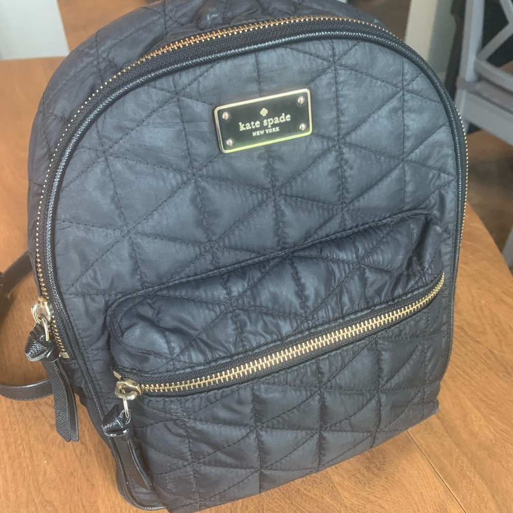 Kate spade backpack black quilted. Some signs of wear but still a great bag!